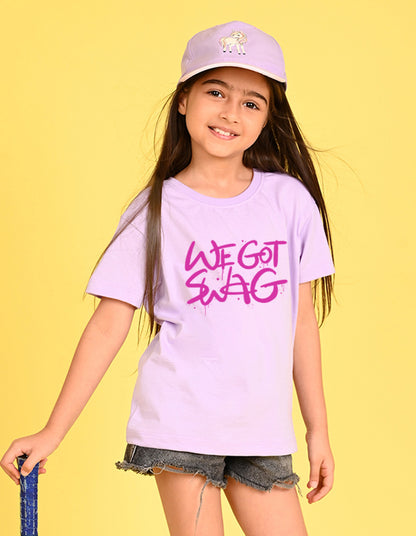 Nusyl Girl's Lilac We Got Swag Text Printed Cotton blend Half Sleeve Drop Shoulder Oversized T-Shirt